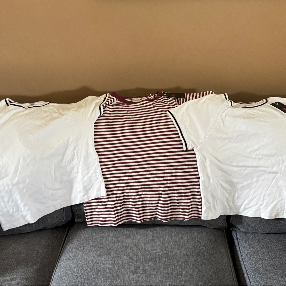 Levi's t shirts NWT. Red and cream size L. Blk & white XL $15 for all three.